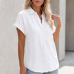 White FJØRNA women's collared button-up blouse with cuffed sleeves and chest pocket, styled on a model.