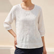 White floral cotton summer blouse for women by FJØRNA, stylish and lightweight top perfect for warm weather.