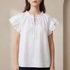 White FJØRNA summer blouse for women with cap sleeves and ruffle detail, perfect for warm weather and casual outings.