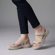 White FJØRNA orthopedic comfort fit sandals with chunky sole and adjustable straps, showcasing a casual open-toe design.