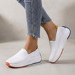 White FJØRNA women's orthopedic sneakers with knit upper and arch support for comfortable, supportive footwear.