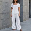 FJØRNA Coastal Breeze relaxed white top and wide-leg pant set, casual 2-piece outfit with soft fabric and comfortable fit.