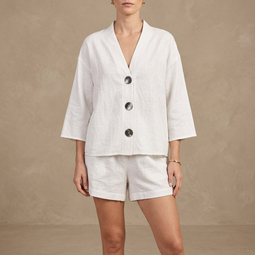 FJØRNA oversized white lounge set with button details, includes relaxed shorts and a matching top for comfortable casual wear