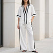 FJØRNA coastal chic contrast trim white top and wide-leg pants 2-piece set, with stylish detailing and relaxed fit.