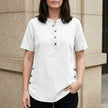 White denim summer top for women with button-front from FJØRNA, styled with a casual, lightweight design.