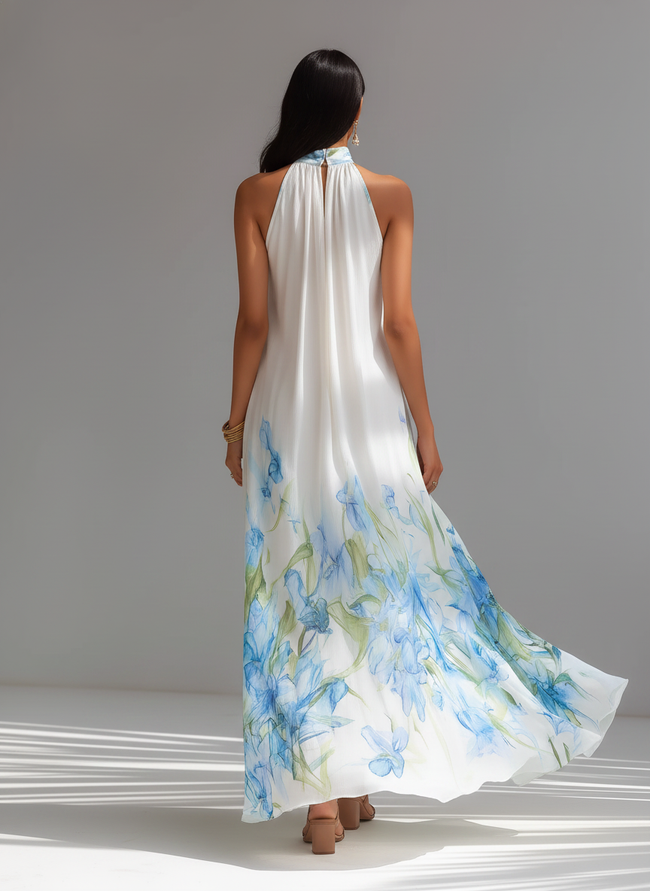 White chiffon halter neck maxi dress by FJØRNA featuring a flowing silhouette and elegant evening style.