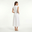 White women's sleeveless lace panel midi dress by FJØRNA, back view showing smooth fabric and elegant design.