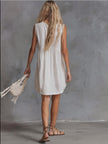 White lace V-neck mini dress by FJØRNA, casual style with delicate lace details and a flattering V-neckline.