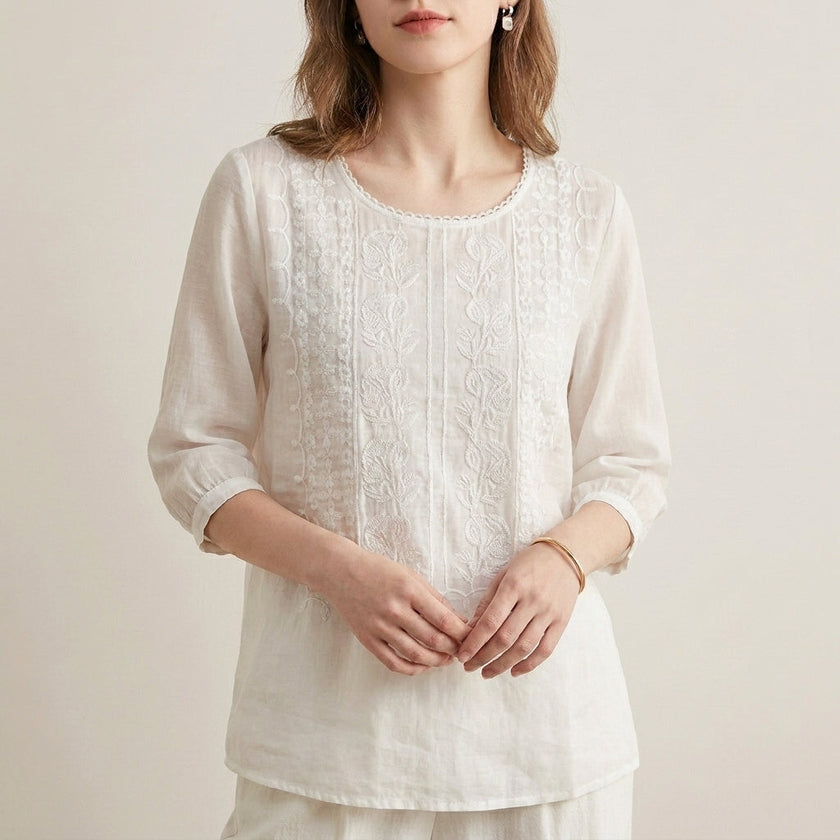 FJØRNA women's summer floral V-neck blouse in white, lightweight top with a feminine, flowy design for warm weather.