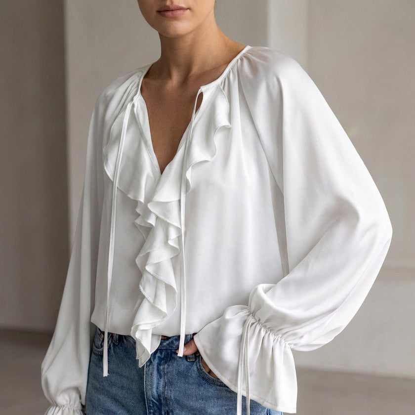 White women's summer blouse with V-neck and lace details, stylish and lightweight top from FJØRNA.