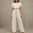 FJØRNA Coastal Breeze textured two-piece lounge set with white wide-leg pants, comfortable and stylish for relaxed wear.