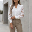 White women's summer blouse with geometric V-neck lace detail, by FJØRNA, featuring a stylish lightweight top for warm weather.