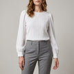 White denim long sleeve pleated blouse for women by FJØRNA, stylish and lightweight summer top with a relaxed fit.