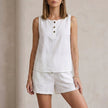 White FJØRNA women's two-piece co-ord set with button-front top and matching pants, stylish and elegant for casual or dressy wear.