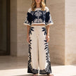 FJØRNA white printed crop top and wide-leg pants matching 2-piece set, casual stylish clothing for women.