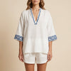 White geometric pockets summer two-piece set for women by FJØRNA, featuring a stylish coordinated top and shorts.