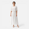 Women's white chiffon pleated maxi dress by FJØRNA, flowing design with pleats, suitable for wedding guests.
