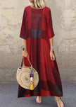 Women wearing FJØRNA khaki plaid maxi dress with half sleeves and ruffle detail, styled as an elegant O-neck dress.