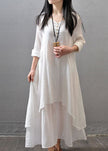 FJØRNA white vintage maxi dress with long sleeves, double layers, button details, and asymmetric hem, perfect for elegant style.