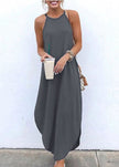Women wearing a white sleeveless straps high-low hem casual maxi dress by FJØRNA, showing the flowing fabric and stylish design.