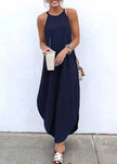 Women wearing FJØRNA sleeveless white maxi dress with high-low hem, casual style, featuring straps and solid fabric.