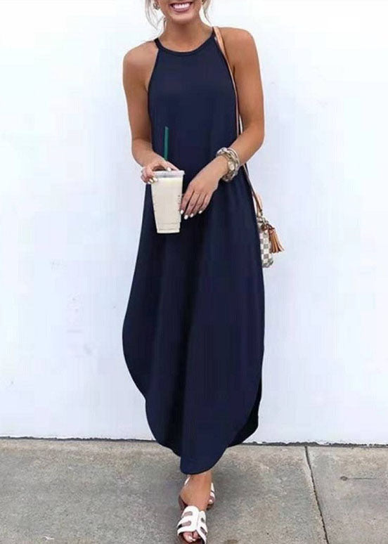 Women wearing FJØRNA sleeveless white maxi dress with high-low hem, casual style, featuring straps and solid fabric.