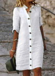 Women’s white stand collar cotton dress with buttons, short sleeves, and a casual elegant style by FJØRNA.
