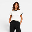 Women’s FJØRNA contrast trim knit top with short sleeves and crew neck, showcasing a stylish, casual women’s shirt.
