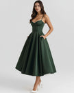 Women's corset midi dress with tulle skirt by FJØRNA, showcasing a fitted bodice and flowing tulle fabric for elegant style.