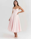 Women’s FJØRNA corset midi dress with a tulle skirt, featuring a fitted bodice and flowing layered tulle for elegant style.