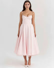 Women’s FJØRNA corset midi dress with tulle skirt, featuring fitted bodice and flowing layered tulle for elegant evening wear.