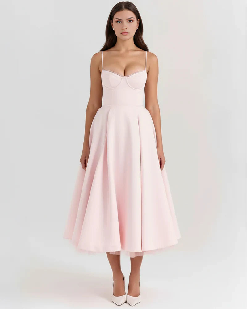 Women’s FJØRNA corset midi dress with tulle skirt, featuring fitted bodice and flowing layered tulle for elegant evening wear.