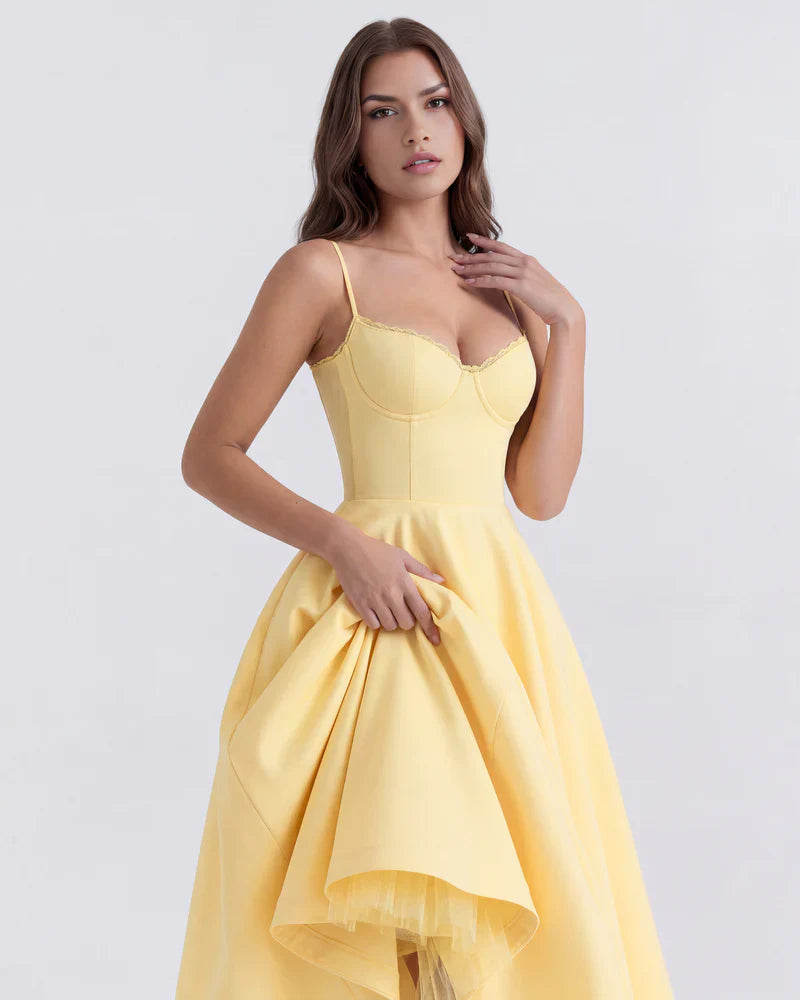 FJØRNA women's corset midi dress with a tulle skirt, featuring a fitted bodice and flowy, layered tulle fabric for elegant style.