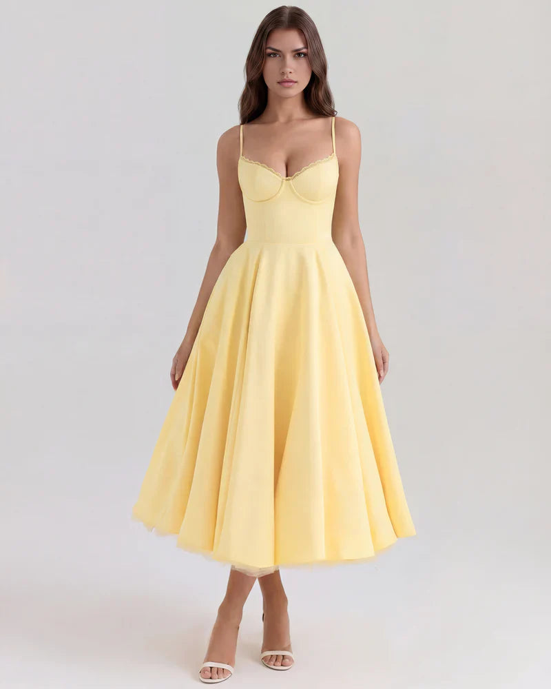 Women's corset midi dress with tulle skirt by FJØRNA, featuring a fitted bodice and flowing tulle for an elegant look.