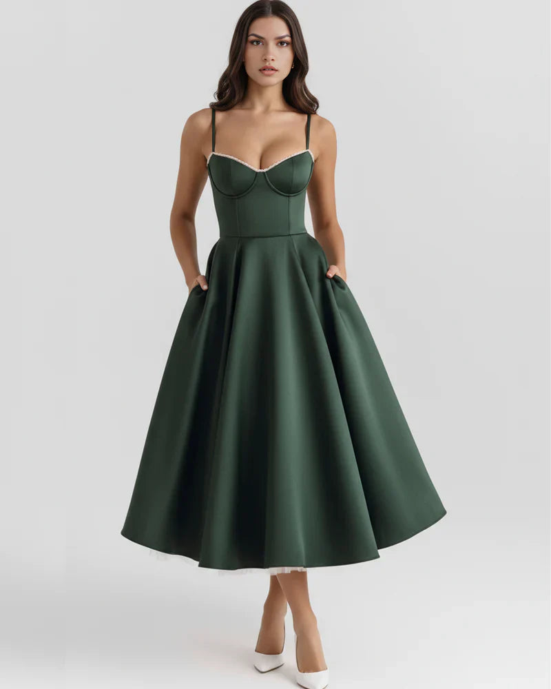 Women's corset midi dress with tulle skirt by FJØRNA, showcasing a fitted bodice and flowing tulle fabric for elegant style.