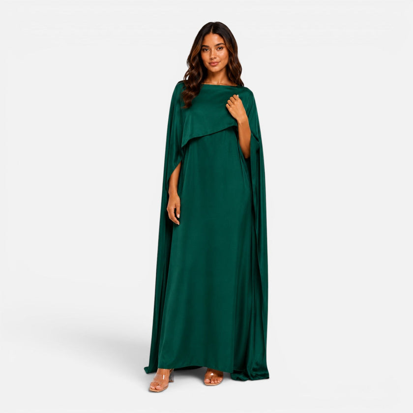 Women wearing FJØRNA women's draped sleeve maxi dress, flowing fabric, elegant design perfect for formal occasions.