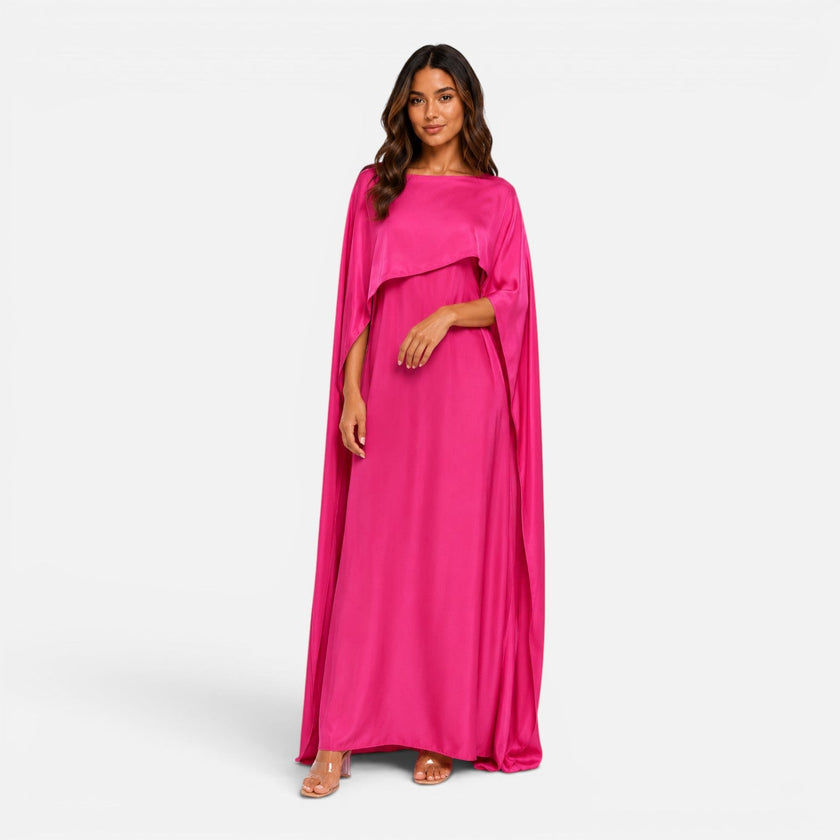 Women wearing a navy FJØRNA draped sleeve maxi dress with flowing fabric and elegant design.