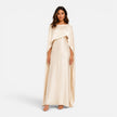 Women wearing FJØRNA women's draped sleeve maxi dress featuring flowing fabric and elegant design, full-length view.