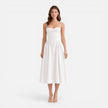 Women's elegant midi A-line dress by FJØRNA, featuring a strap design perfect for wedding guests, shown on a model.