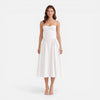 Women's elegant midi A-line dress by FJØRNA, featuring a strap design perfect for wedding guests, shown on a model.