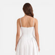 Women’s elegant midi A-line dress by FJØRNA, perfect for wedding guests, featuring a strap design and sophisticated style.