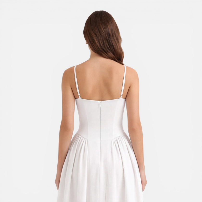 Women’s elegant midi A-line dress by FJØRNA, perfect for wedding guests, featuring a strap design and sophisticated style.