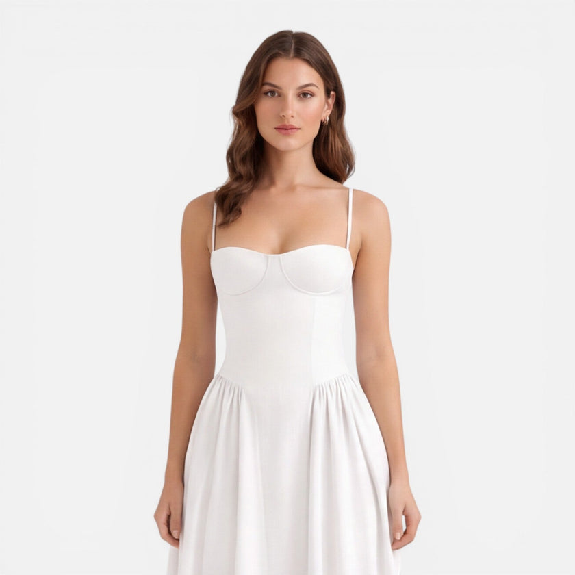 Women’s elegant strap A-line midi dress by FJØRNA, perfect for wedding guests, featuring a sophisticated design and flowing fabric.