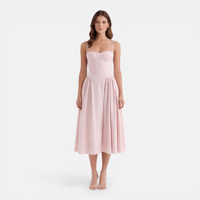 Women's elegant midi dress by FJØRNA featuring a strap A-line design, perfect for wedding guests, shown in a flattering silhouette.