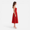 Elegant women's midi A-line dress by FJØRNA, featuring a strap design, suitable for wedding guests.
