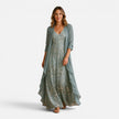 Women wearing a floral embroidered maxi dress with a matching chiffon jacket, stylish and elegant outfit by FJØRNA.