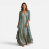 Women wearing a floral embroidered maxi dress with a matching chiffon jacket, stylish and elegant outfit by FJØRNA.