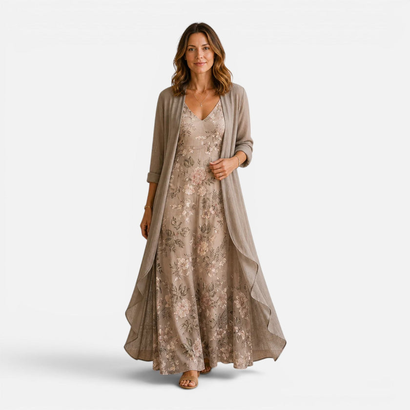 Women's floral embroidered maxi dress with chiffon jacket from FJØRNA, featuring intricate embroidery and flowing chiffon fabric.