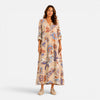 Women’s boho floral print V-neck maxi dress by FJØRNA, flowing fabric with vibrant floral pattern, sleeveless design.
