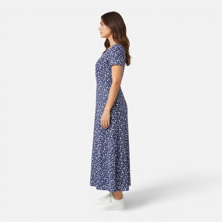 Women's floral V-neck midi dress by FJØRNA, perfect for summer occasions and weddings, featuring a feminine, elegant design.
